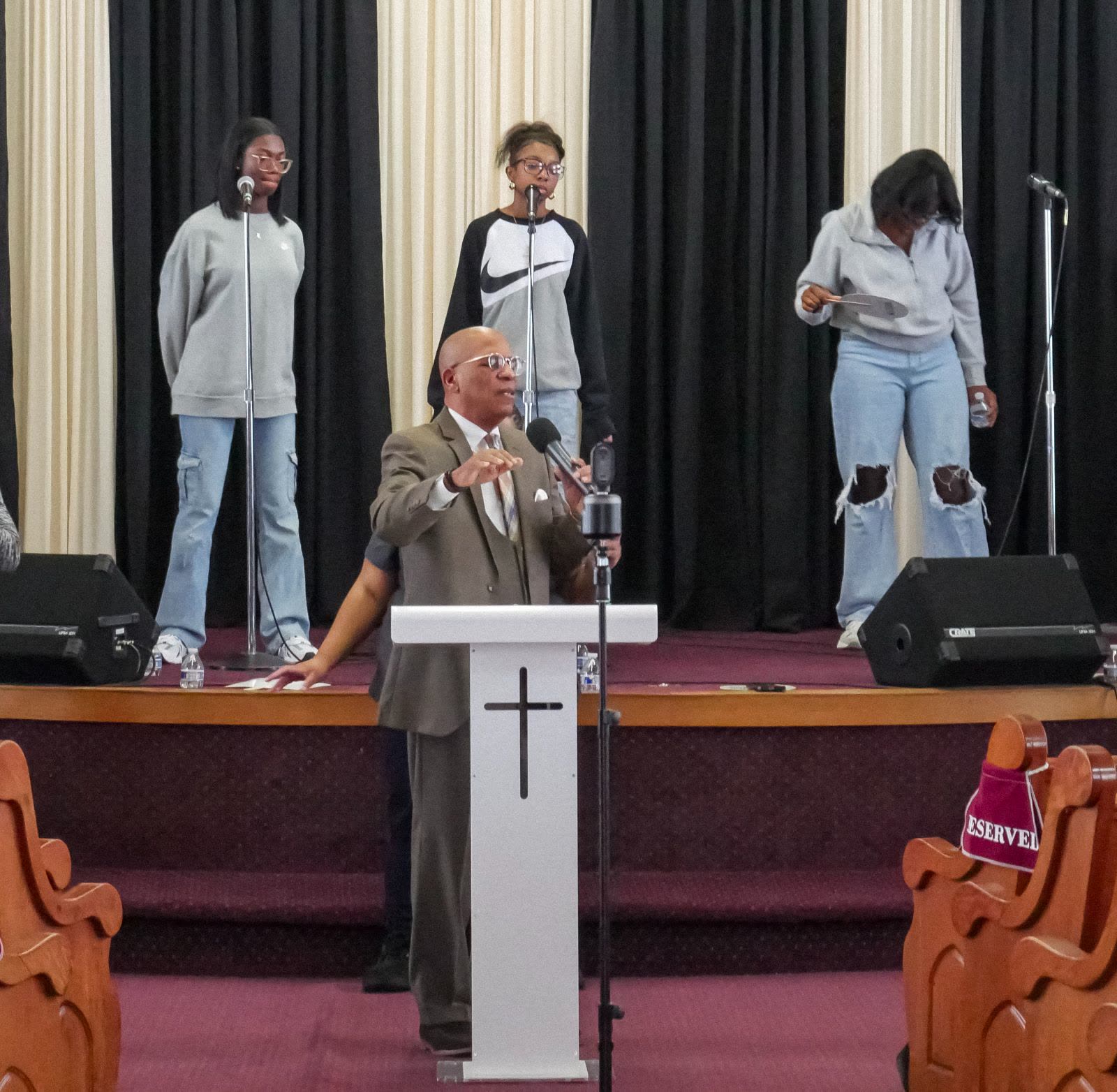 Pastor teaching from the Bible during a service